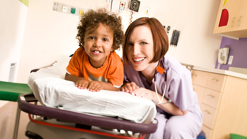 Photo of female pediatrician and her patient